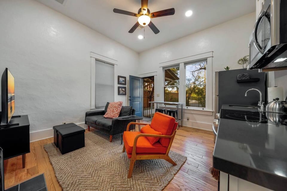 UNIT #1: Cozy living room space with comfortable seating, smart TV, and electric fireplace