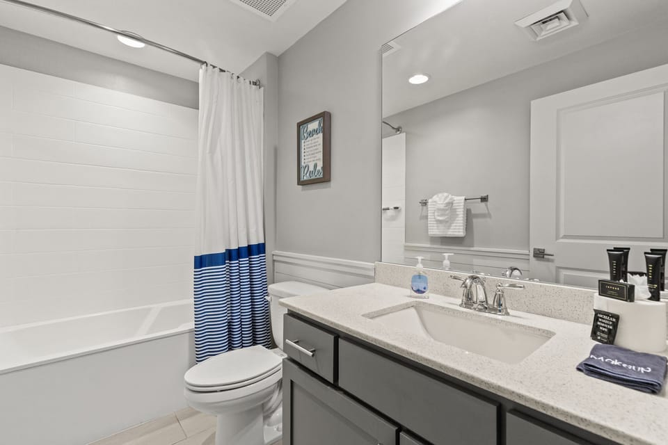 Second bath with shower/tub across from bunks.
