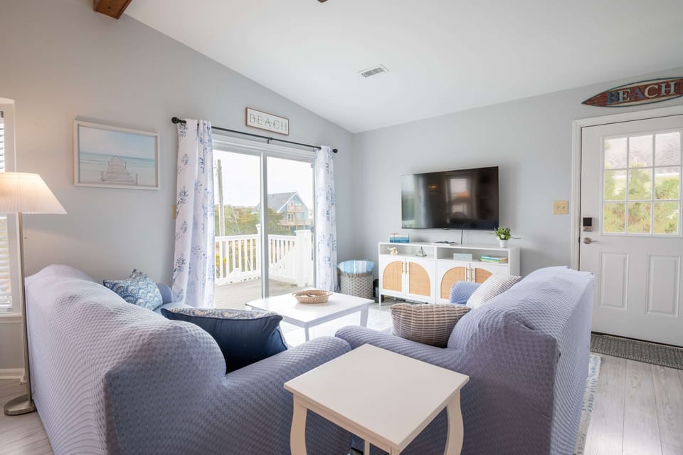Living Room has sliders to front porch