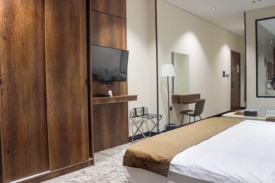 Luxury Studio Suite | Premium bedding, blackout drapes, soundproofing, iron/ironing board