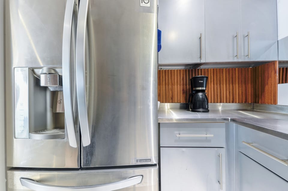 Family Suite, City View | Private kitchen | Full-size fridge, microwave, stovetop, blender