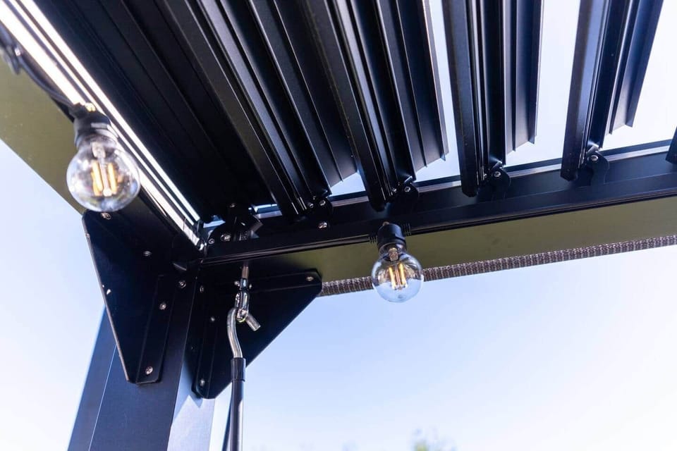The deck is covered by a pergola that can be opened/closed to make the most of the sun or provide shelter on hot or rainy days and still enjoy the el fresco lifestyle. At night create the perfect ambiance to match your mood with festoon lighting.