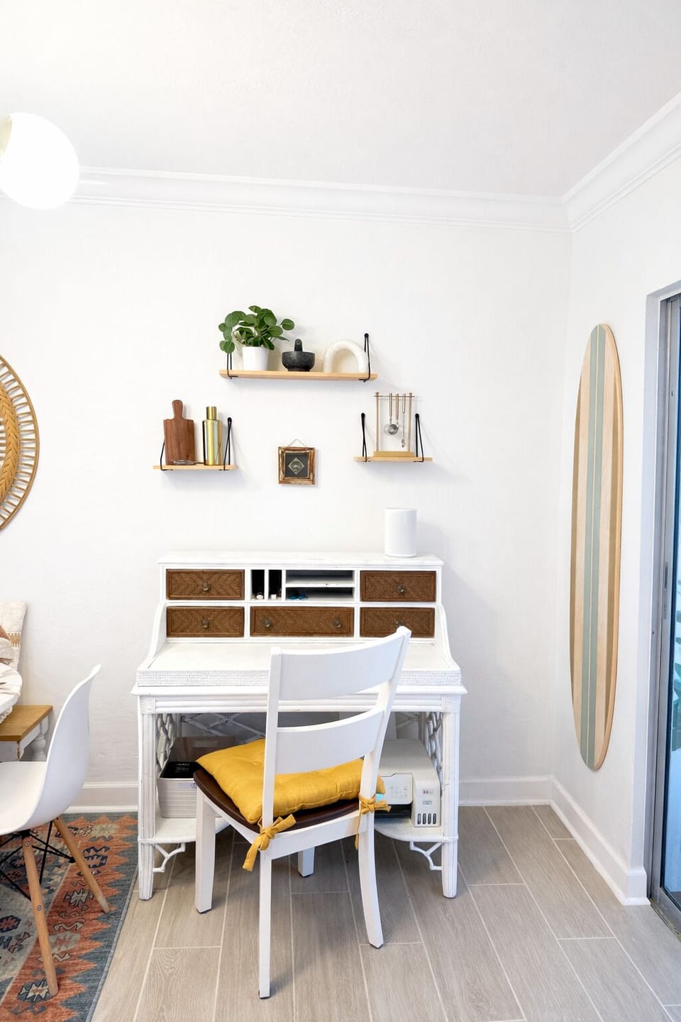 Dedicated workspace with desk and stylish shelving.
