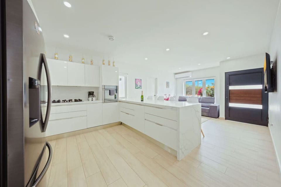 Spacious open kitchen with a large island and modern appliances.