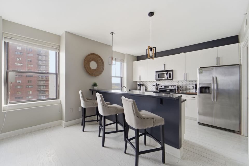 Three large comfy high top chairs are perfect for entertaining while cooking your favorite meals.