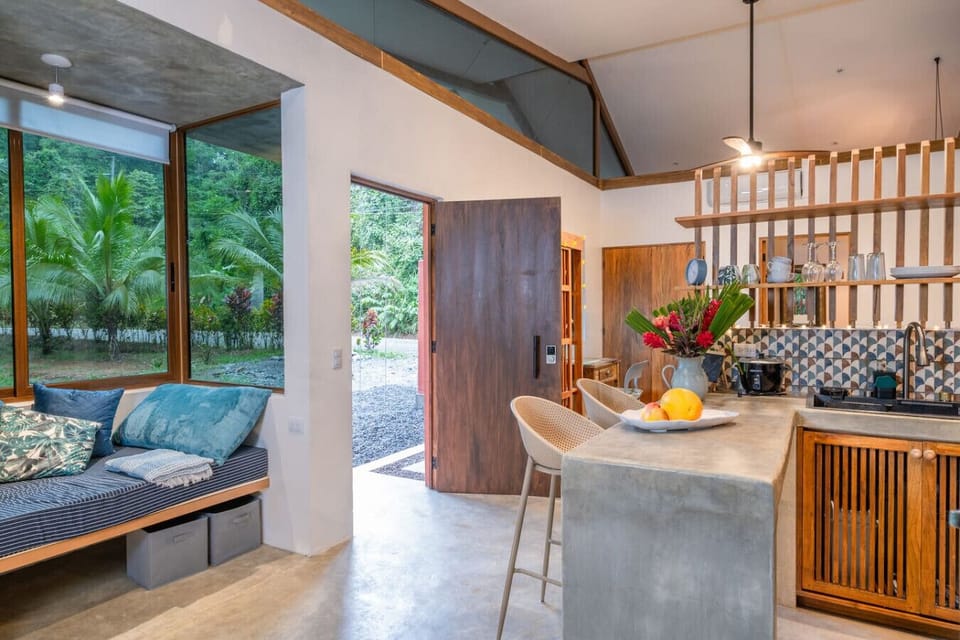 Bright and airy studio with AC, cozy window seat, and private kitchen in Puerto Viejo.