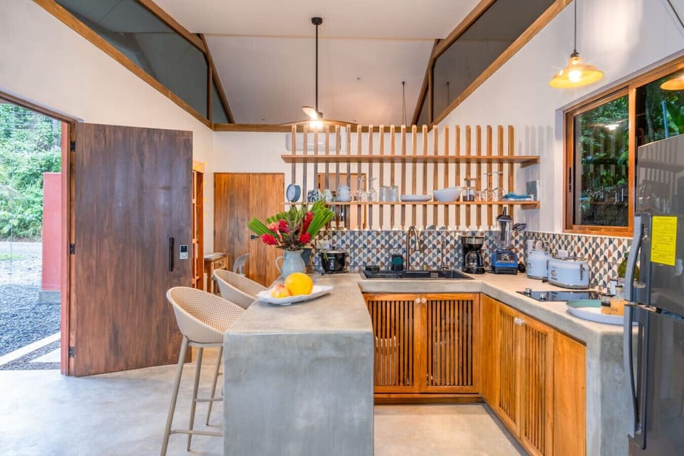 Fully equipped kitchen with polished concrete finishes in Puerto Viejo.