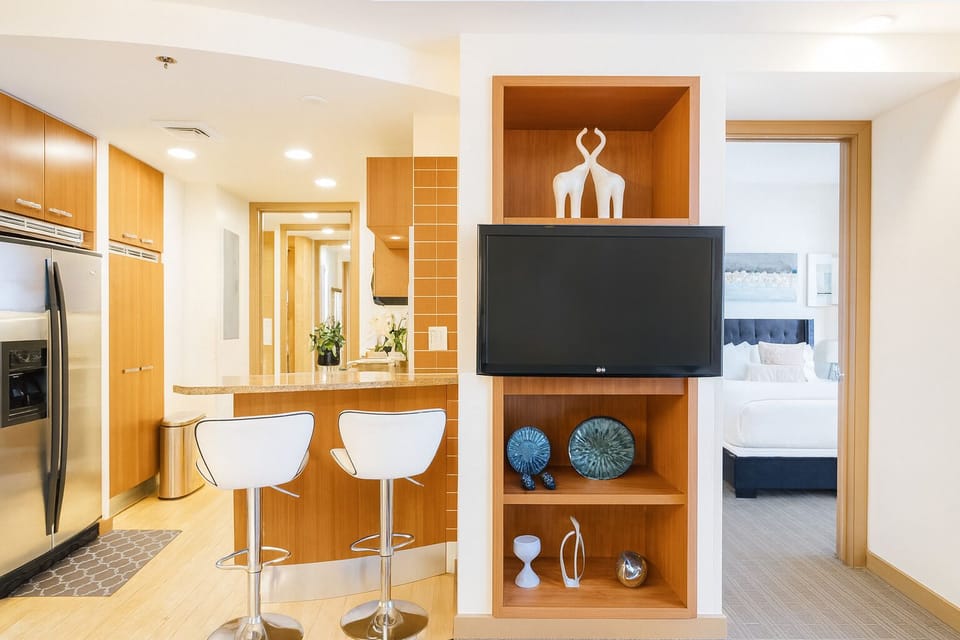 Deluxe Suite, 1 Bedroom, Balcony | Living area | 55-inch Smart TV with satellite channels, Netflix, streaming services