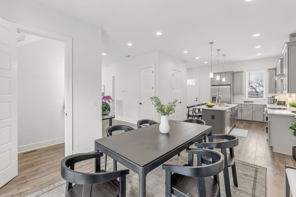 Dining area and kitchen, with half bath for freshening up