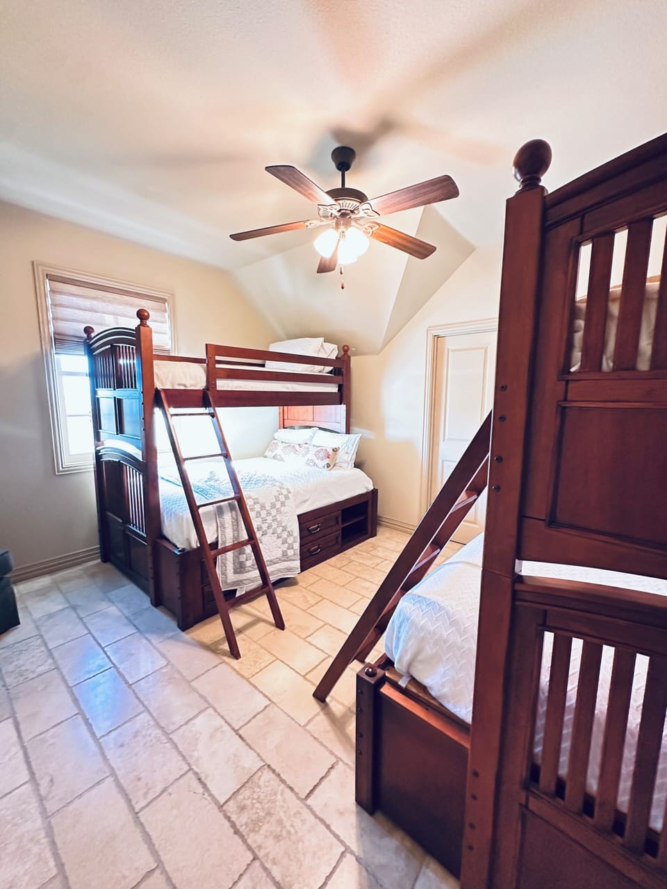 Two bunk beds. Both bottom bunks are full size mattresses.