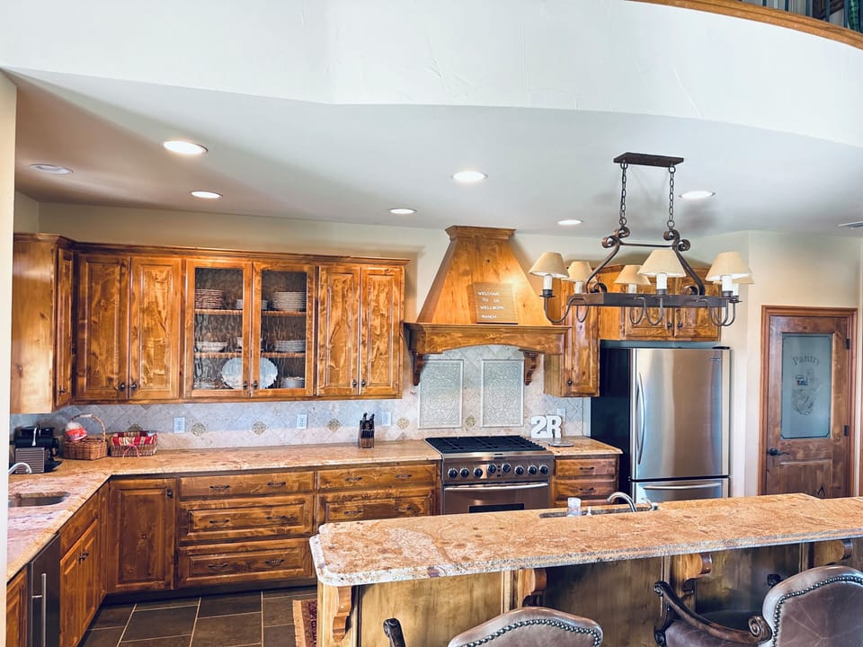 Kitchen has gas stove and ice maker.