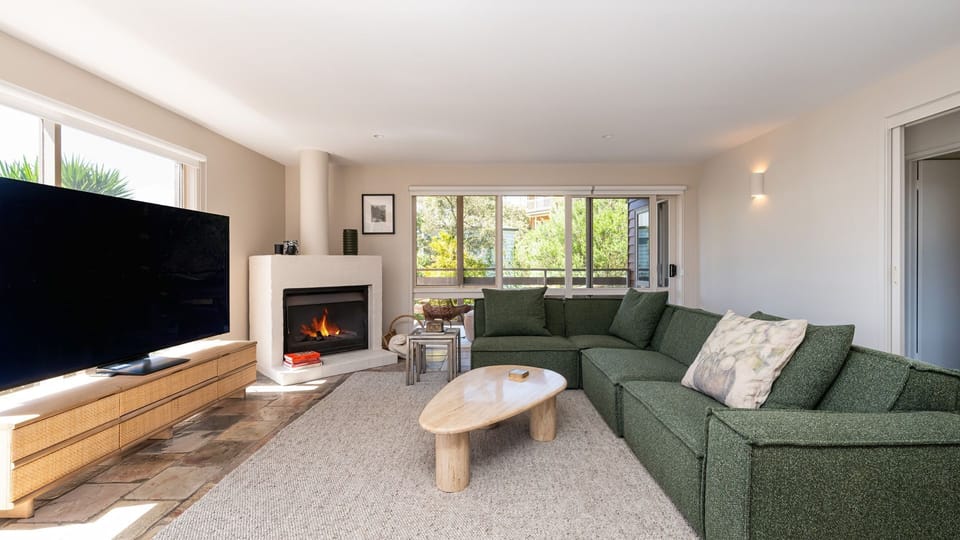Lounge area with the fireplace and TV