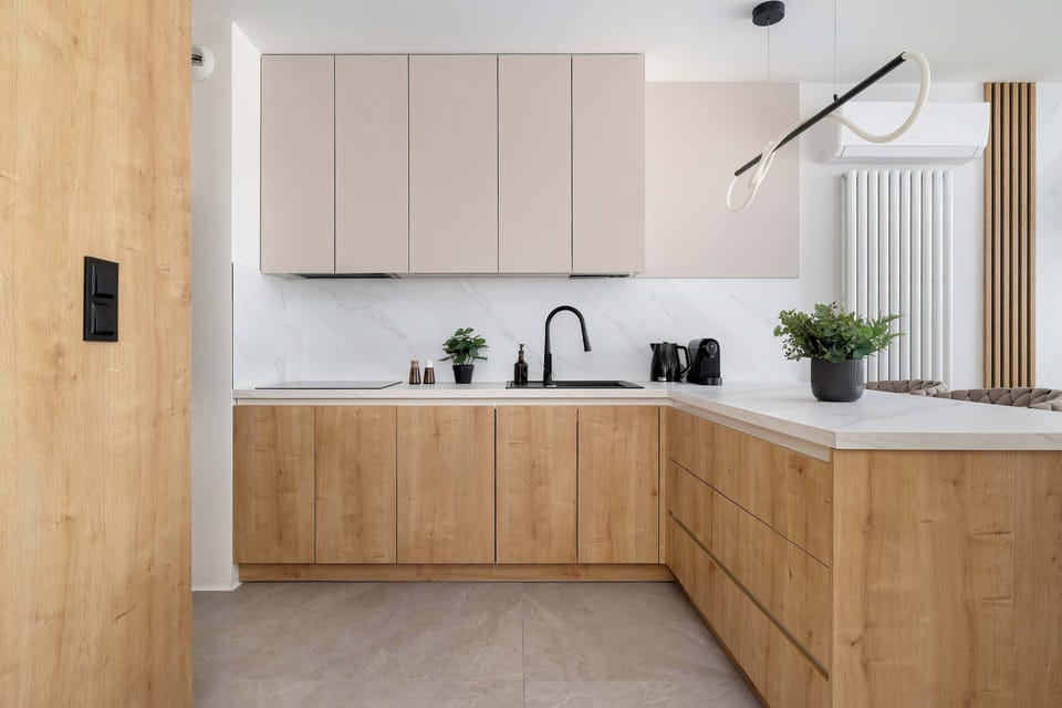 Modern open-plan kitchen with full-size appliances, plenty of storage and a clean, minimalist design.