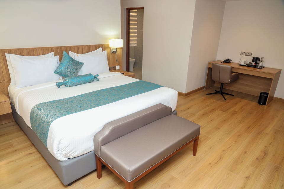 Executive Suite, City View | In-room safe, desk, laptop workspace, iron/ironing board