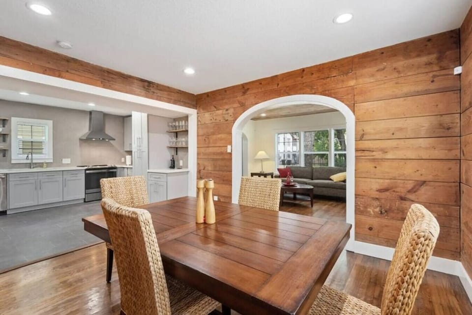 An open floor plan connecting kitchen and dining so the family stays together during meals and conversation.