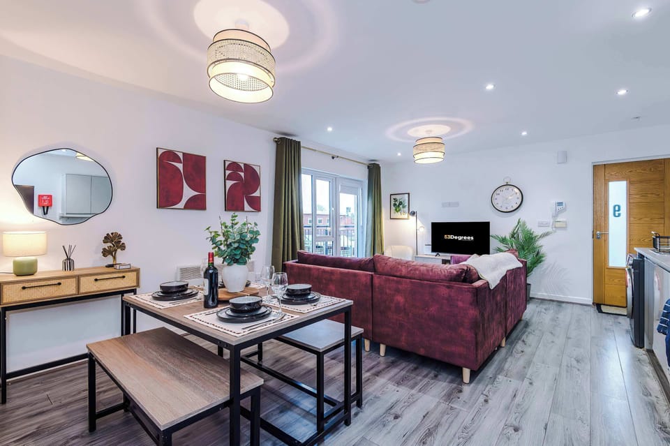 Relax in the stylish and open living room, with ample seating both inside and out on the balcony. The living room features a 40 inch SMART TV, perfect for enjoying a film together!