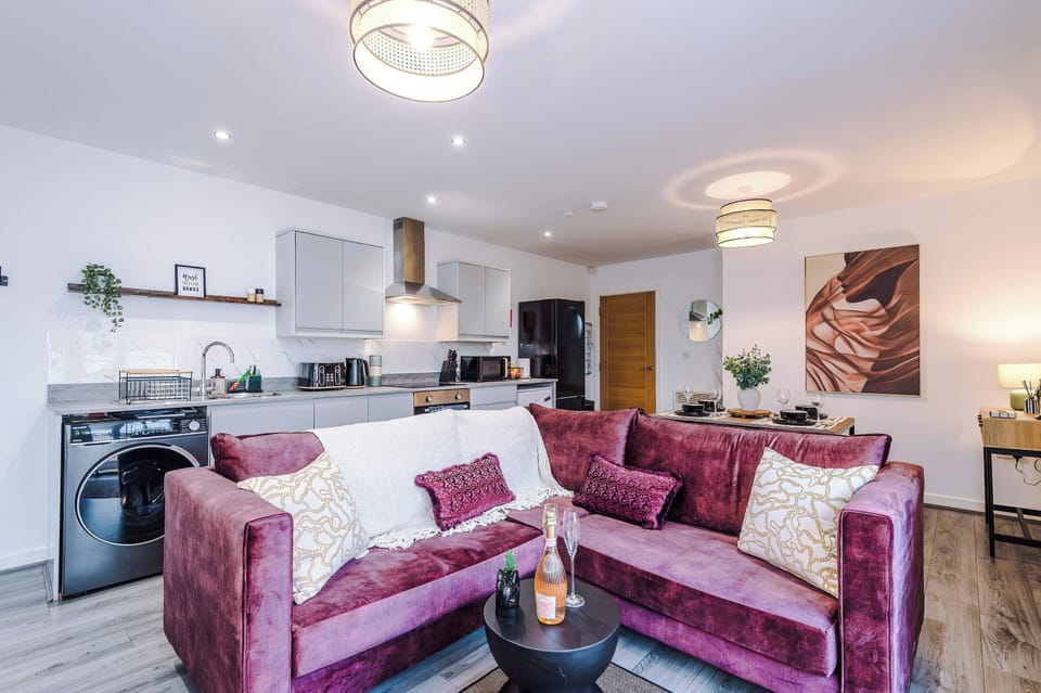 Relax in the stylish and open living room, with ample seating both inside and out on the balcony. The living room features a 40 inch SMART TV, perfect for enjoying a film together!