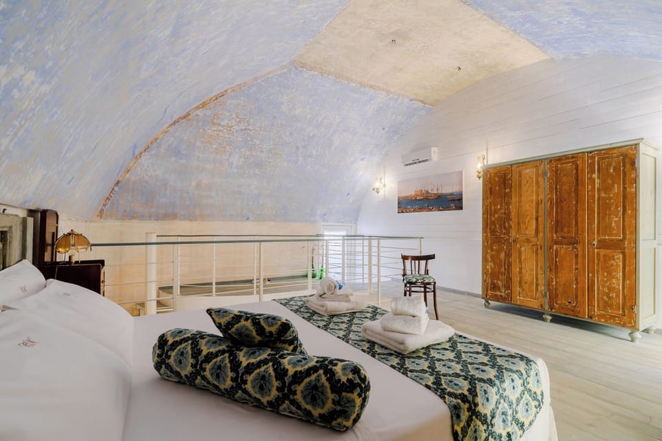 Junior Suite, Balcony, Courtyard View | Minibar, blackout drapes, iron/ironing board, free cribs/infant beds