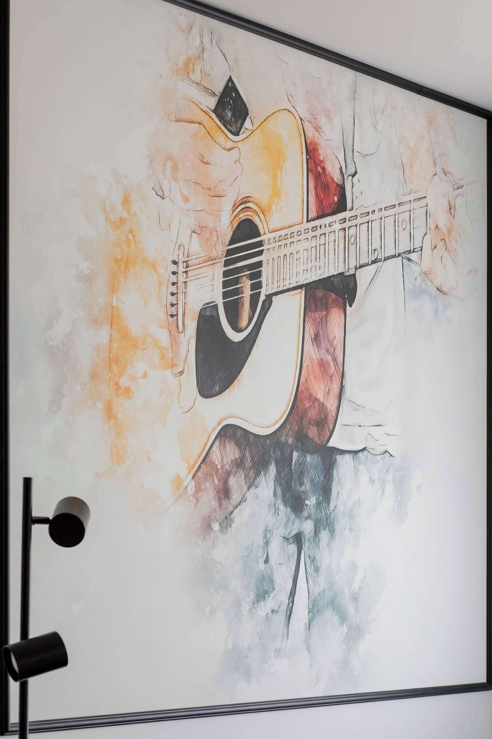 A contemporary wall artwork that enhances the apartment’s modern character. The subtle color palette and artistic design add a touch of sophistication and personality to the space.