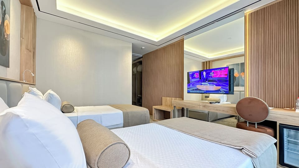 Standard Twin Room, Balcony, Partial Sea View | In-room safe, desk, laptop workspace, blackout drapes