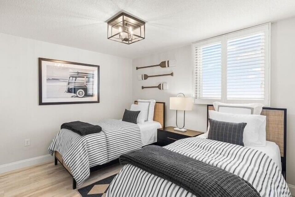 The third bedroom offers 2 twin beds and its own television.