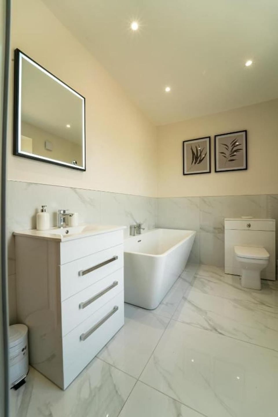 Separate tub and shower, deep soaking tub, hair dryer, towels