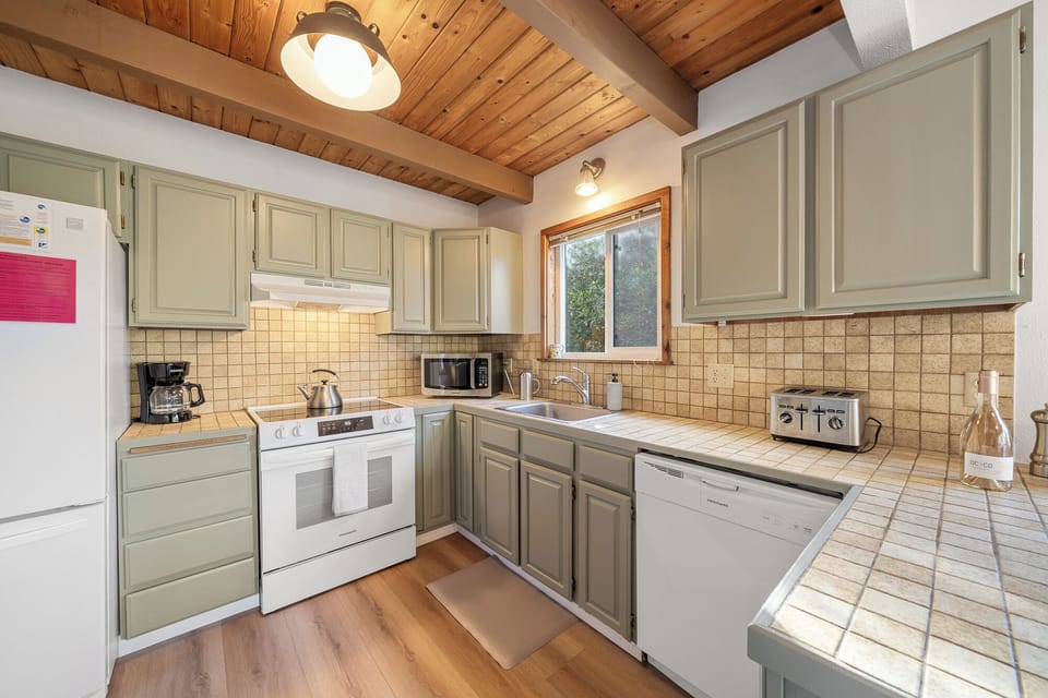 Kitchen is fully equipped with Stove, dishwasher, refrigerator