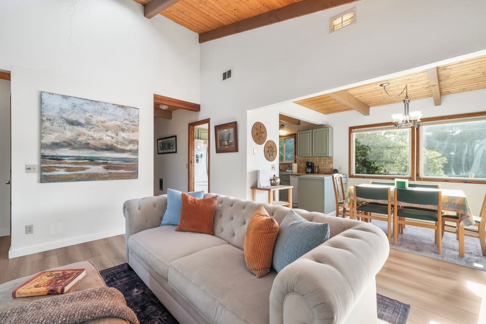 Comfy living room and streaming TV, with access to outside deck and open to the living room.