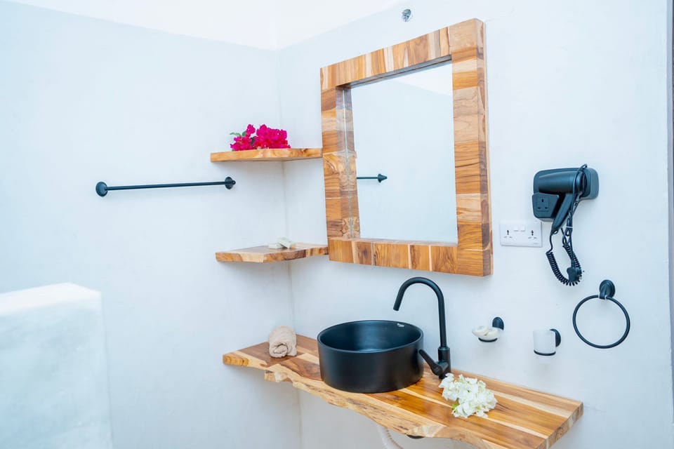 Deluxe Double Room, Balcony, Beach View | Bathroom | Shower, hair dryer, towels, soap