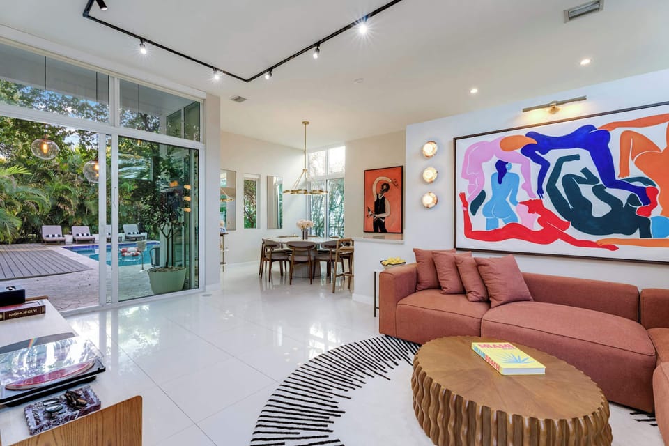 Indoor-outdoor living at its finest. From the vibrant gallery walls to the poolside loungers, paradise is just a step away