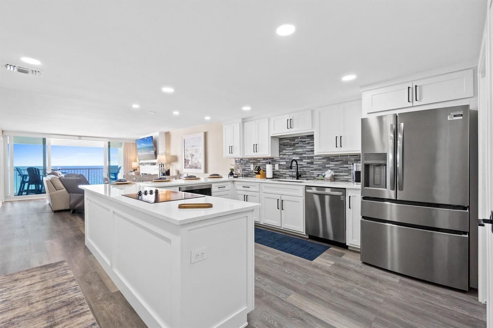 Your gourmet kitchen features granite countertops, stainless appliances, and stunning ocean views that make cooking a joy.
