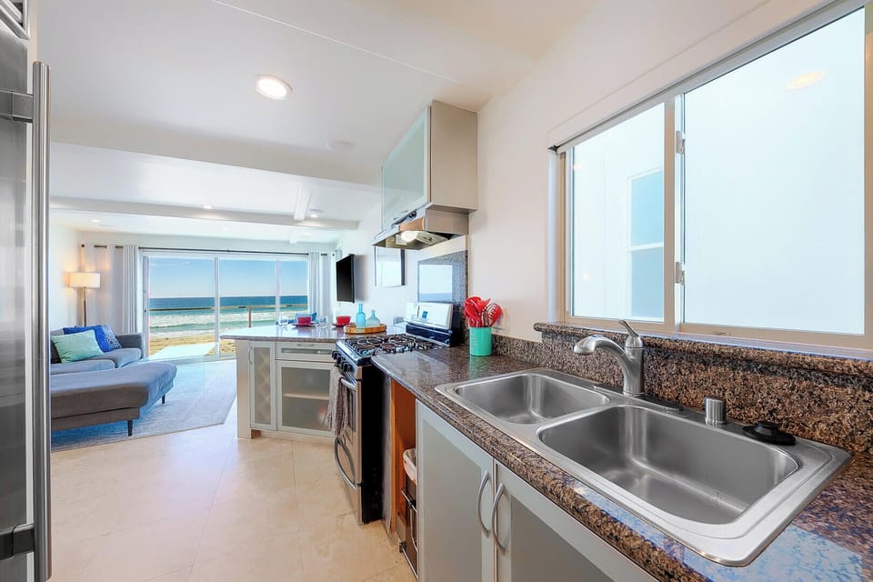 Kitchen equipped with a dual sink, offering extra convenience and functionality for cooking, cleaning, and meal prep.