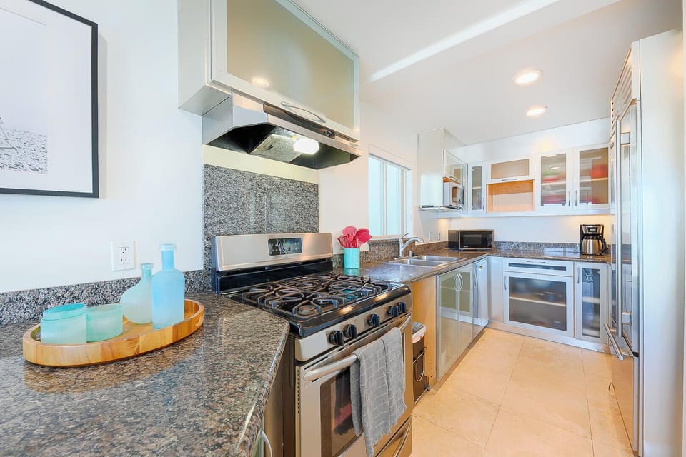 Modern kitchen featuring sleek stainless steel appliances, combining style and functionality for effortless cooking and entertaining.