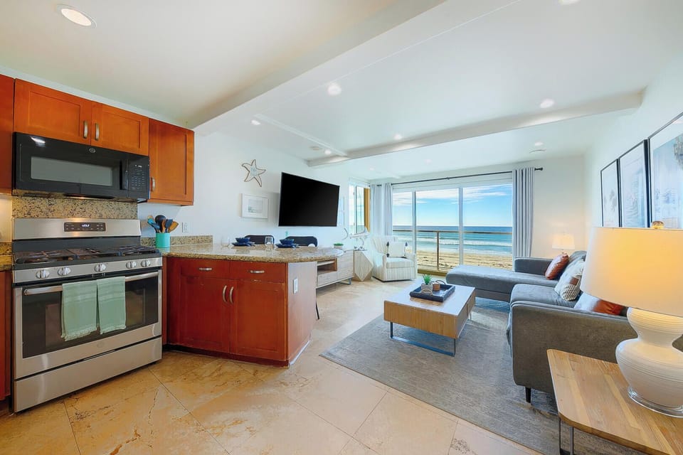 Open-concept kitchen and living area designed for comfort and connection, with a seamless flow that's perfect for relaxing, cooking, and gathering together.
