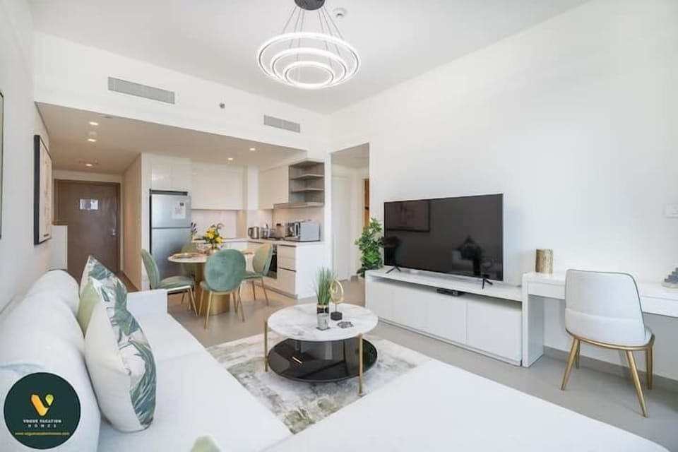 Luxury Apartment, Balcony, City View | Living area | 65-inch Smart TV with cable channels