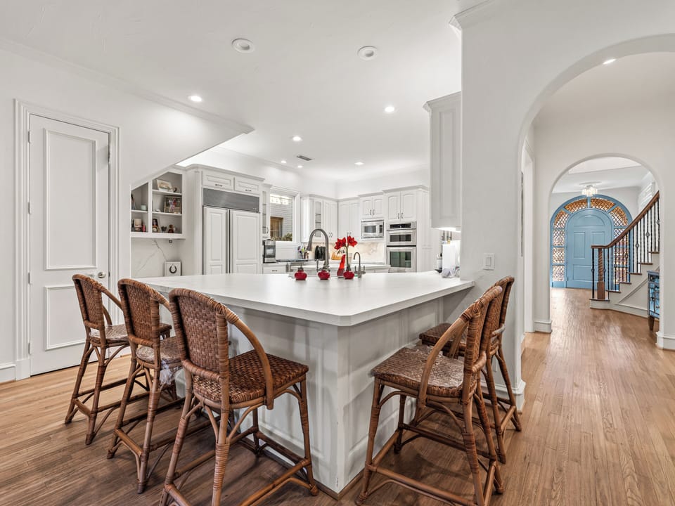 Your spacious gourmet kitchen features a stunning marble island where you can gather for casual meals or morning coffee.