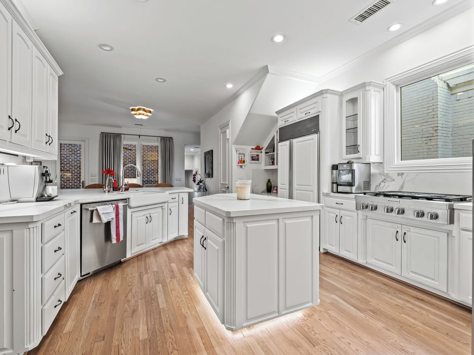 Your gourmet kitchen awaits with marble countertops, stainless steel appliances, and a spacious island perfect for cooking memorable meals together.
