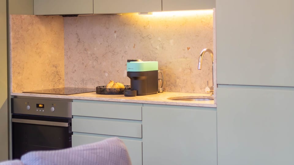 Kitchenette with a sleek design and clean lines. #KitchenGoals #FunctionalDesign