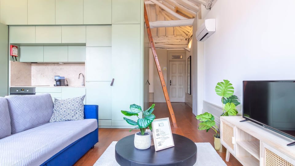 Functional and stylish living room with an open kitchen design. #ModernLiving #FunctionalSpace