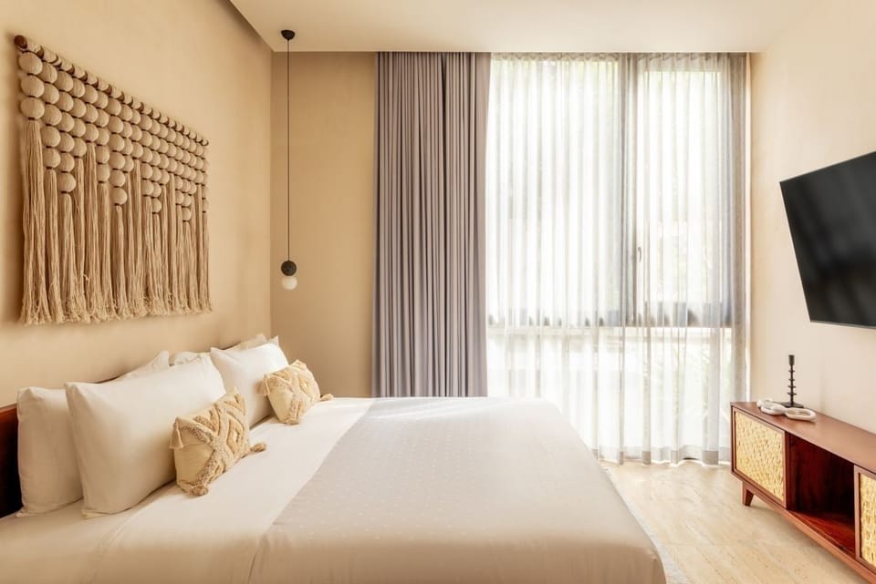 Drift off in a serene suite with soft light and TV.