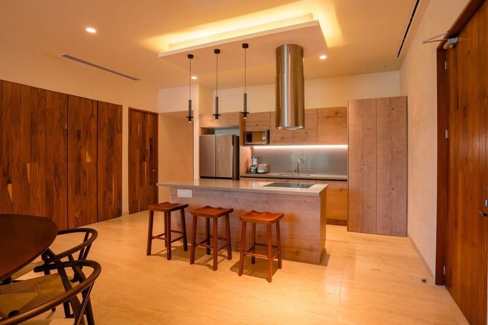 Cook with ease in a sleek kitchen with island seating.