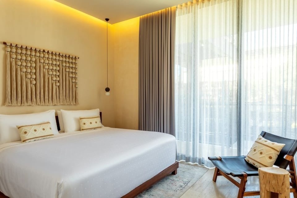 Settle into crisp linens and warm, ambient evening lighting.
