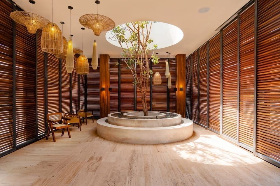 Breathe in calm design under a skylit indoor garden.
