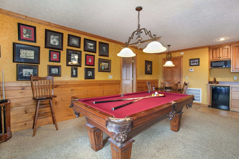 Host game night in the dedicated game room featuring a pool table and scenic mountain views.