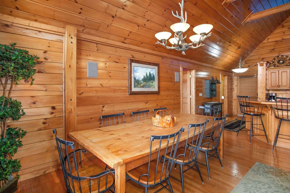 Gather for meals and movies in this bright, open-concept living and dining area.