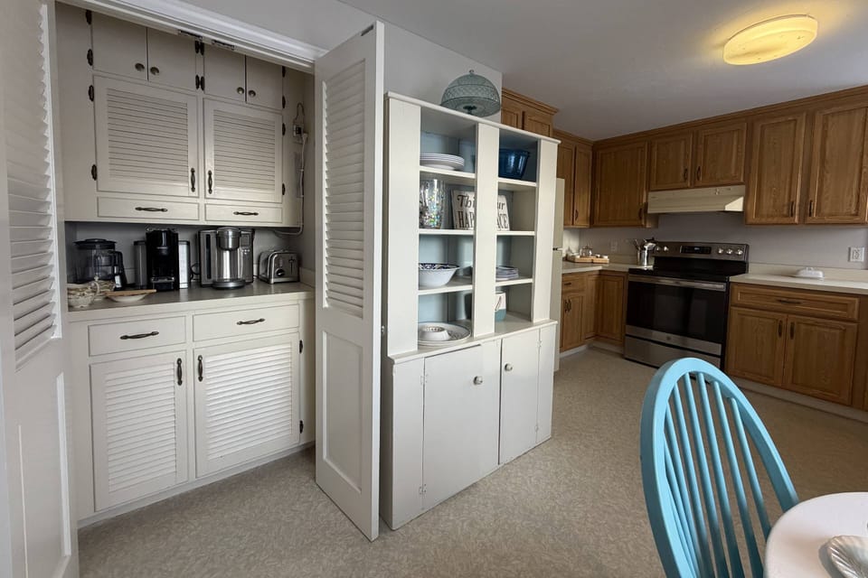 Kitchen is fully stocked with coffee bar and many appliances and serving ware for a large group