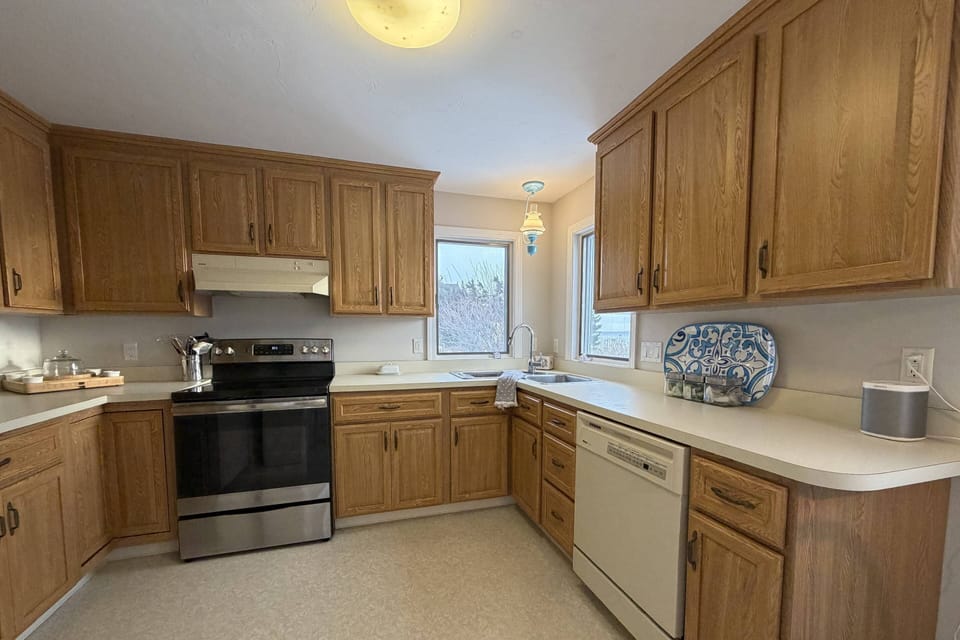 Fully equipped kitchen with stove, oven, and dishwasher