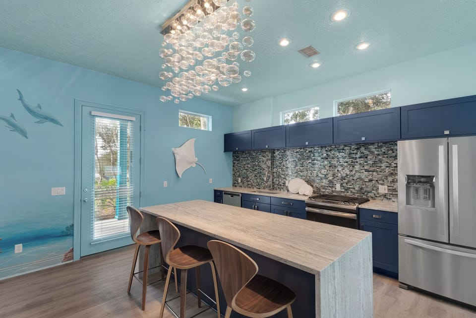 Eat in the kitchen with a waterfall, granite island and new stainless appliances