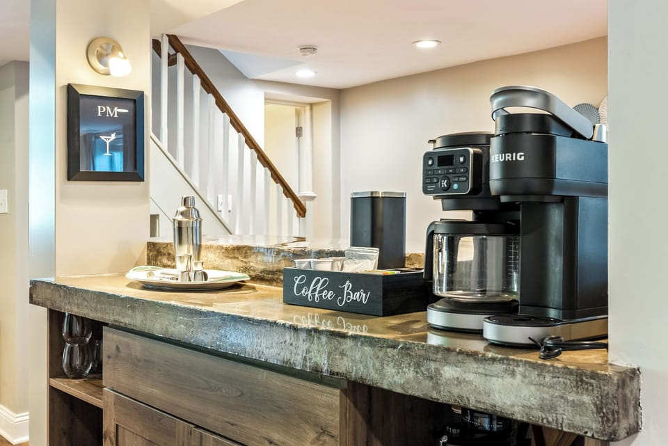Fuel your morning. The garden suite has a Coffee Bar with Keurig, drip and pour over coffee, and electric hot water kettle. The provided "starter pack" includes K-cups, coffee beans, assorted teas, sweeteners, and creamer.