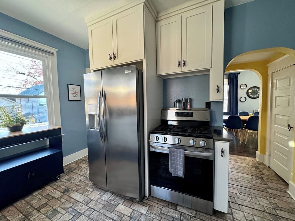 The Main Level Kitchen offers Full size side-by-side refrigerator and range, pantry, and easy access to the Dining Room.